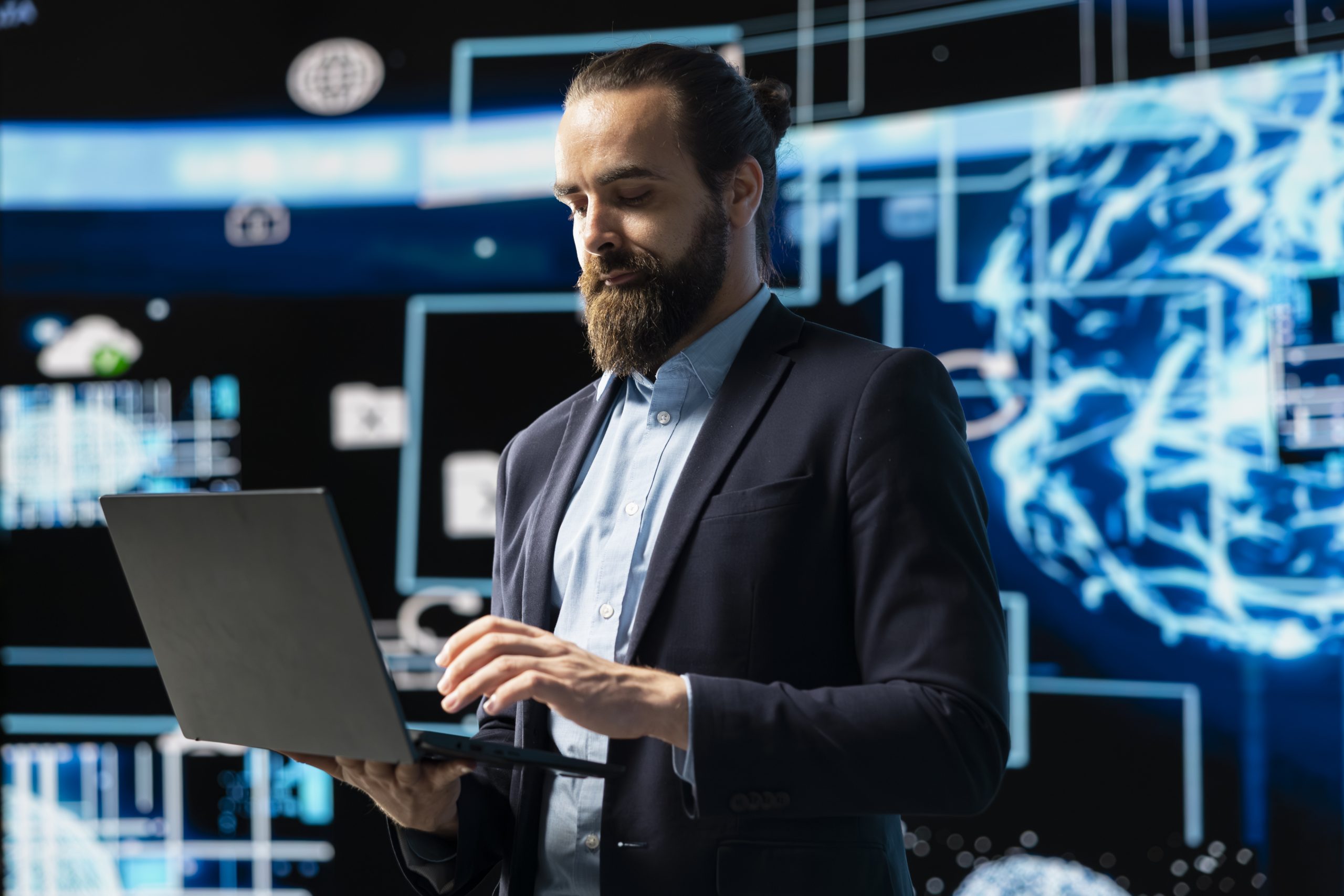 Entrepreneur uses laptop to review artificial intelligence brain system